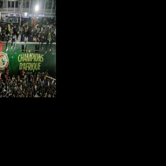 Senegal's football team celebrates winning the Africa Cup of Nations, traveling in a victory parade through Dakar on January 20, 2026
