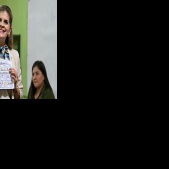 Costa Rican presidential candidate Laura Fernandez shows a ballot before voting
