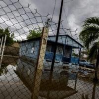 A house is seen partially flooded after Hurricane Erin battered the region in Guayama, Puerto Rico