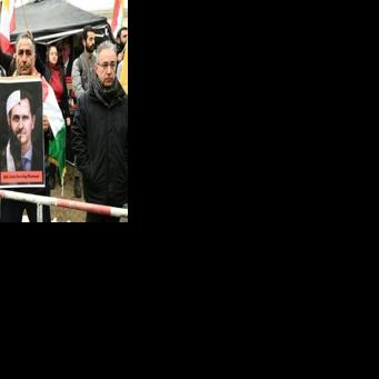 People protest against the visit of Syrian President Ahmed al-Sharaa in front of the German Foreign Ministry