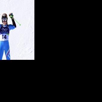 Italy's Federica Brignone celebrates in the finish area after winning the giant slalom