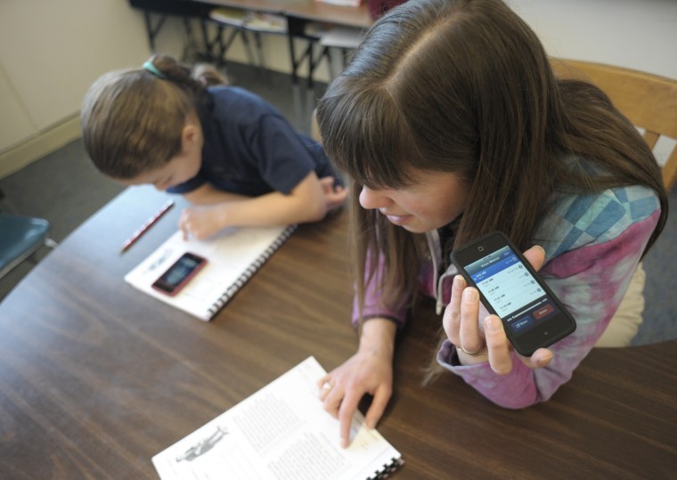 Apple in the classroom: Students using iPods, iPads to improve reading ...