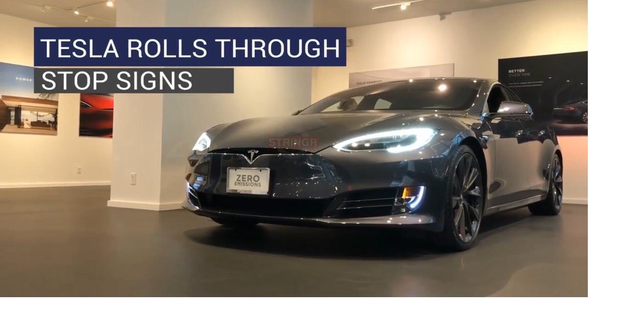 Tesla rolls through stop signs