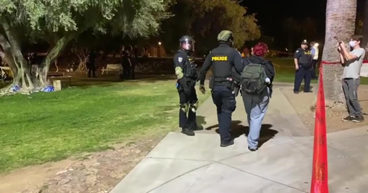 RAW: AZ: POLICE IN RIOT GEAR MEET PROTESTORS AT UA