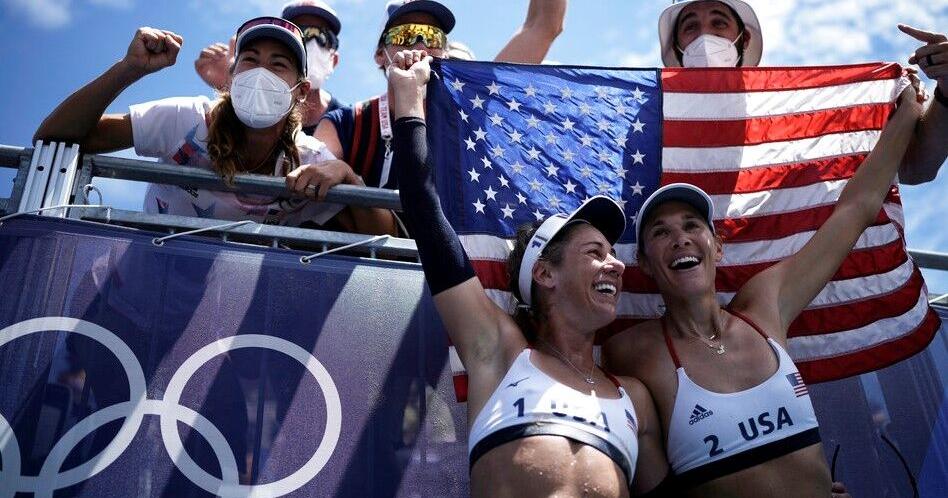 Photos: Olympians proudly display their national flags