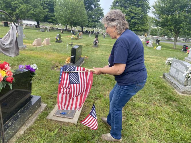 Marlborough scouts place flags on veterans' graves