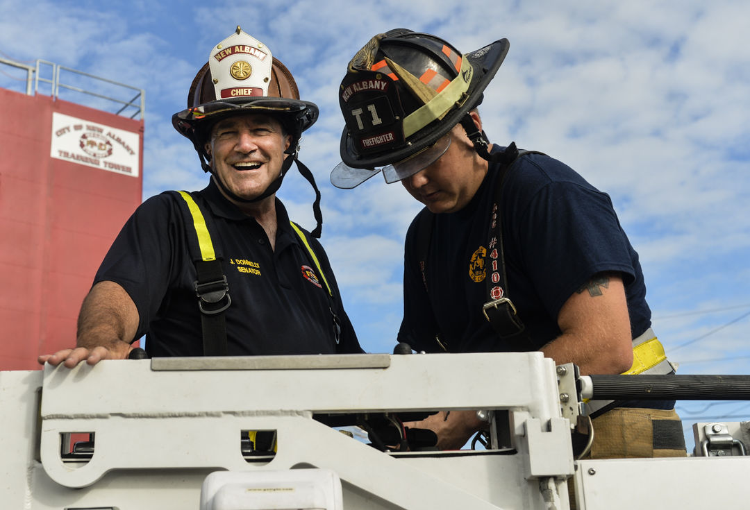 GEARING UP U.S. Sen. Joe Donnelly trains with New Albany firefighters