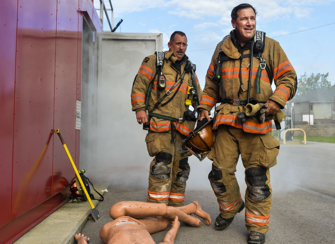 GEARING UP U.S. Sen. Joe Donnelly trains with New Albany firefighters
