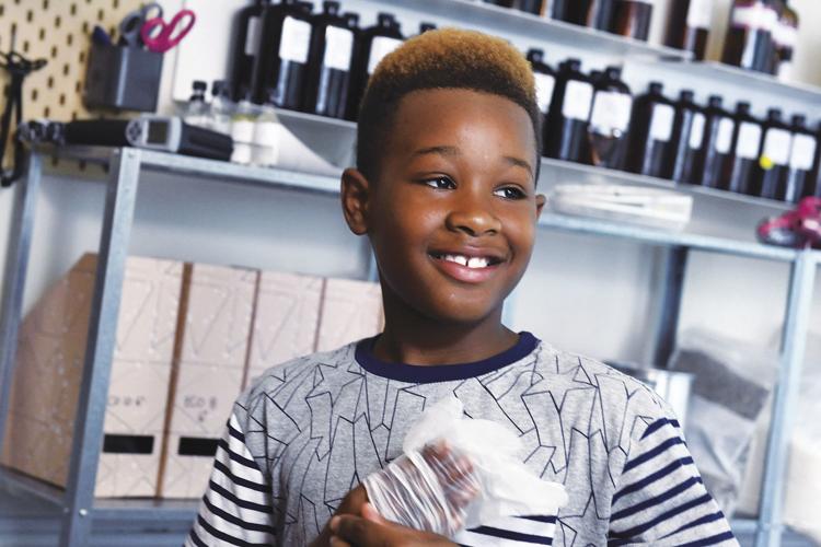 Three young Maryland brothers start candle company with charity in mind