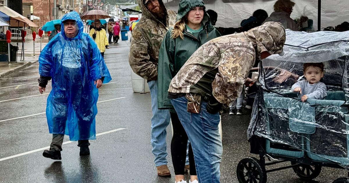 Soggy weather doesn't bother some festival-goers, but all-day rain kept others away