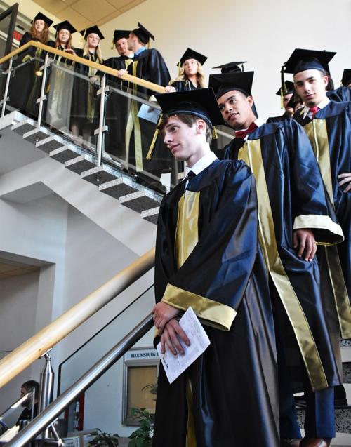 SCA grads descend stairwell