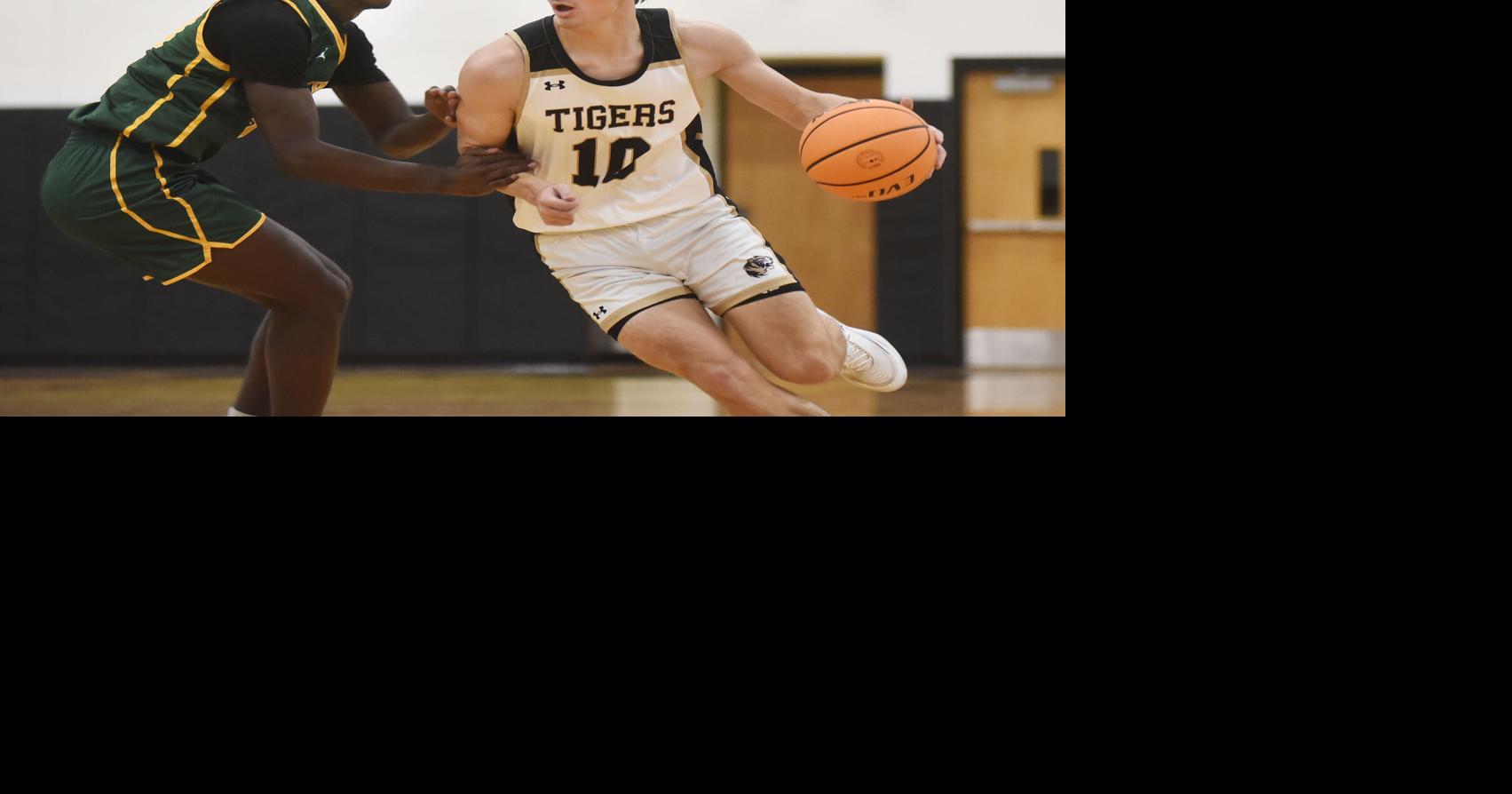 H.S. Boys Basketball: Tigers pulls away from Green Dragons in second ...