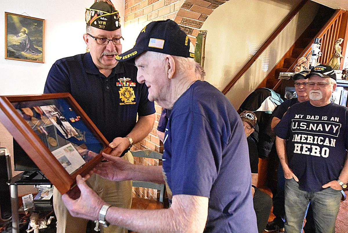 WWII Veteran receives service medals from VFW