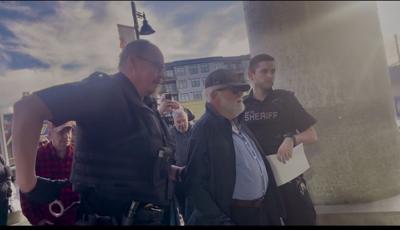 Barry Neufeld arraested at Chiliwack Court House as officer grabs handcuffs Nov 24 2025