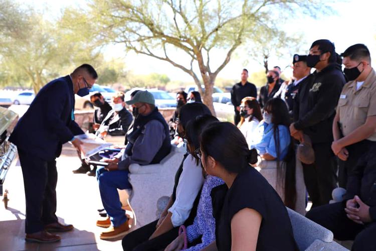 Family of U.S. Army veteran Brian Yazzie receive Navajo and U.S. flags