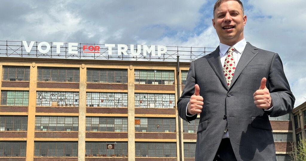 Can the man behind a giant pro-Trump sign ride the president's praise to Congress?