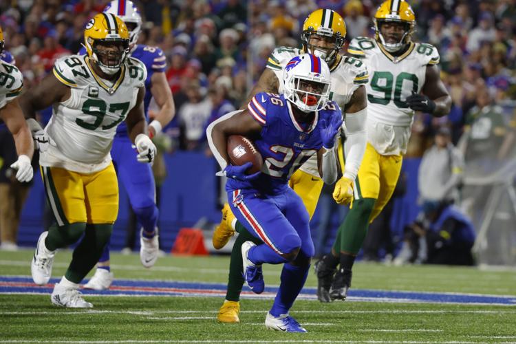 Buffalo Bills running back Devin Singletary (26) runs with the ball during  the first half of an NFL football game against the Pittsburgh Steelers in  Orchard Park, N.Y., Sunday, Oct. 9, 2022. (