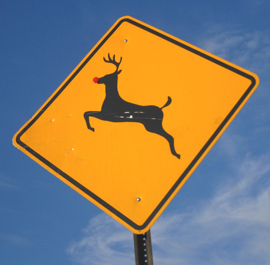 It's Rudolph by a nose: Mysterious elf alters deer crossing signs