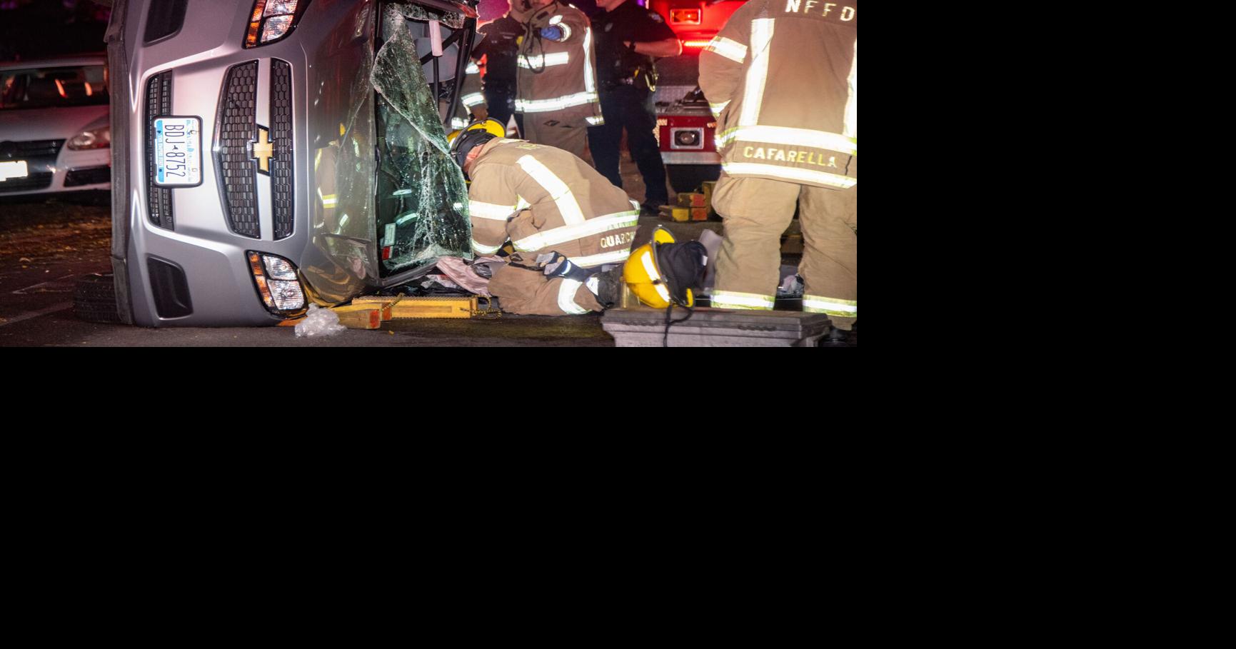 Falls firefighters free woman trapped in overturned car | Local News ...