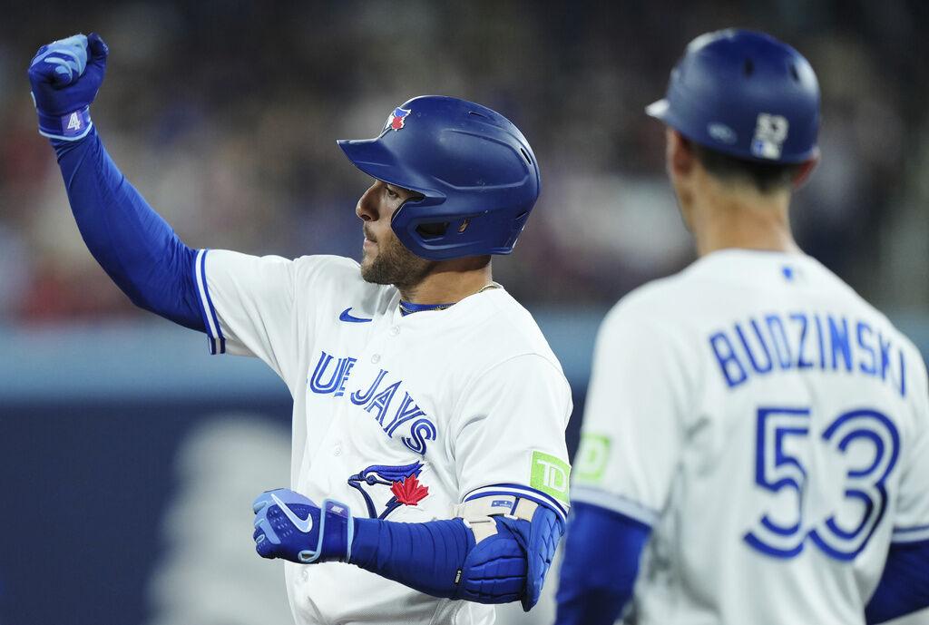 Whit Merrifield of the Toronto Blue Jays celebrates a 2 RBI double in  2023