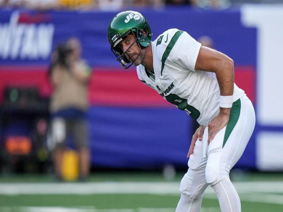 New York Jets quarterback Aaron Rodgers (8) calls out a play to his  teammates during the first half of an NFL preseason football game against  the New York Giants, Saturday, Aug. 26