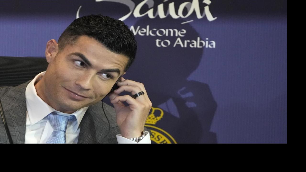 Iranian soccer fans flock to Cristiano Ronaldo's hotel after he arrives in  Tehran with Saudi team