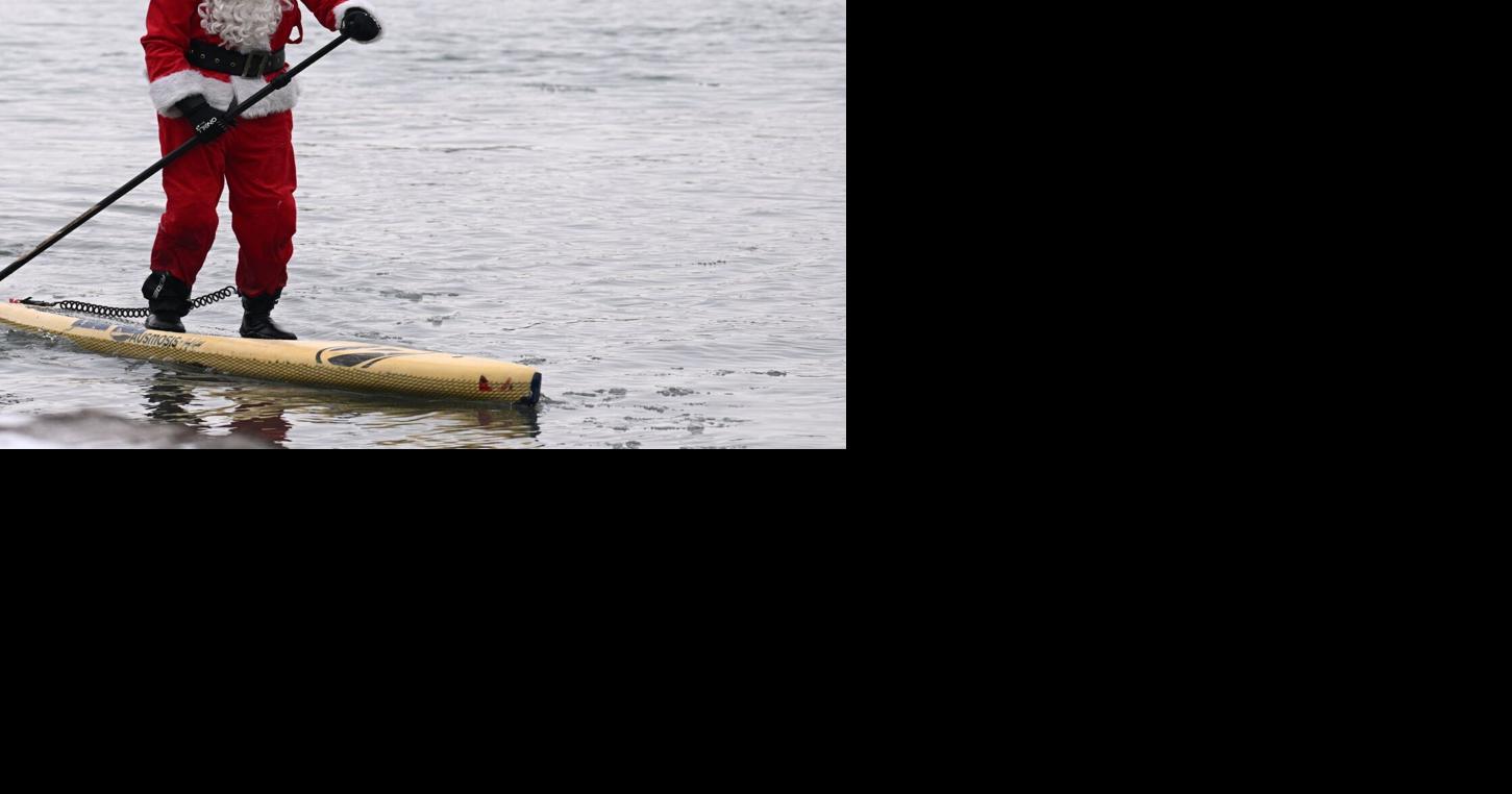 Surfing Santa returning to the waters of the Niagara River