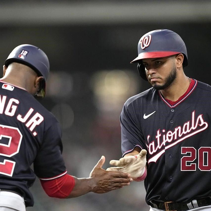 Houston Astros second baseman Jose Altuve throws to first for the out after  fielding a ground ball by Washington Nationals' CJ Abrams during the  seventh inning of a baseball game Thursday, June