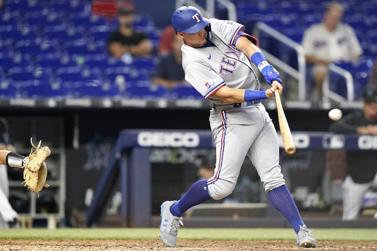Mathias basesloaded walk lifts Texas over Marlins in Game 1