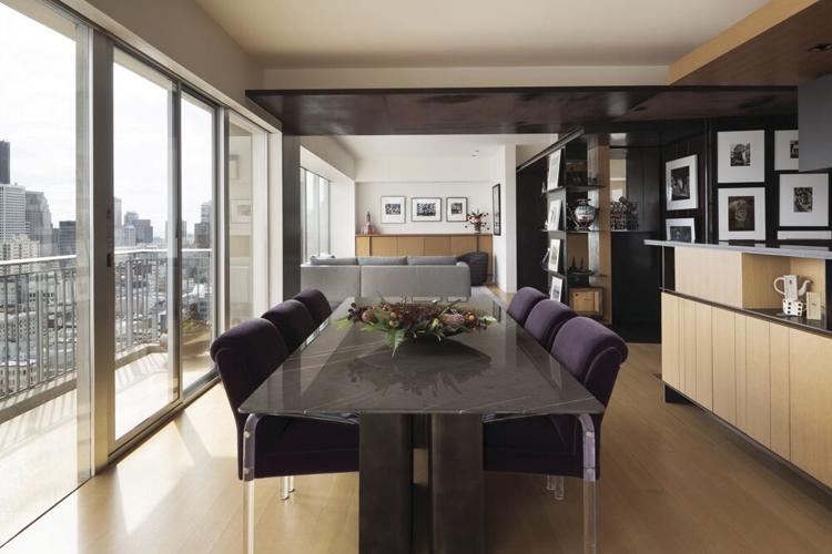 Dining room: Studio Collins Weir reupholstered 1970s dining chairs, which appear to float on Lucite legs, in a Myung Jin mohair from Harsey & Harsey. They surround a graffiti marble table whose round steel base balances the residence’s architectural edg...