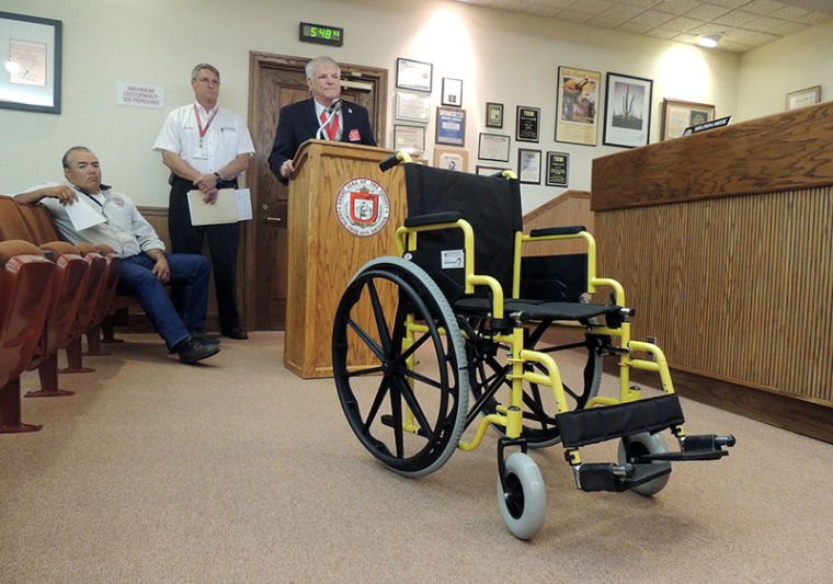 Knights of Columbus distribute wheelchairs for those in need