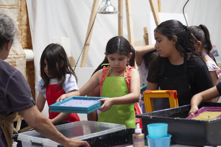 Local kids dive into papermaking process Community
