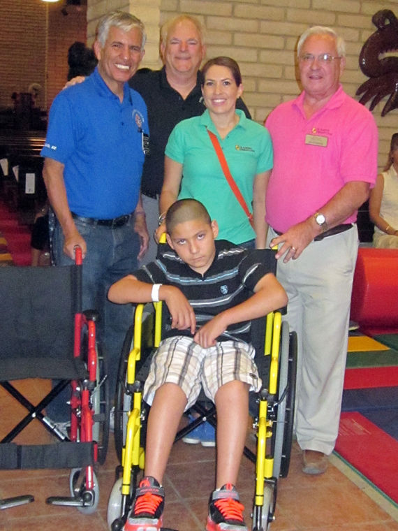 Knights of Columbus distribute wheelchairs for those in need