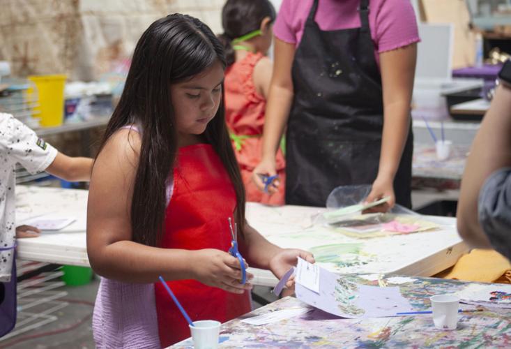 Local kids dive into papermaking process Community