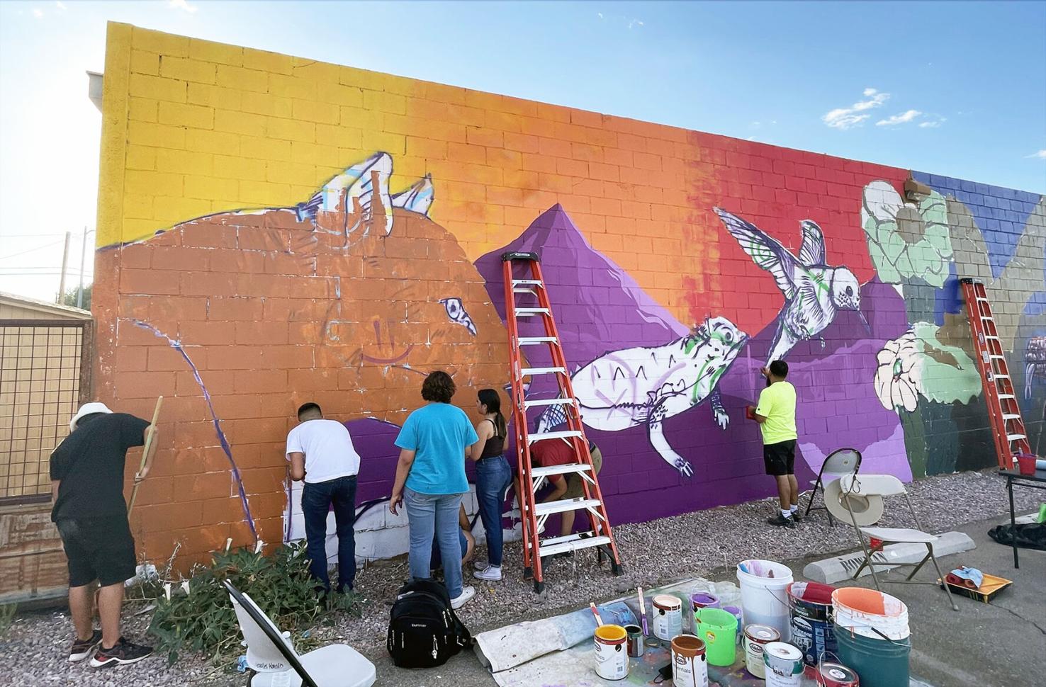 High school students help paint desert mural in downtown Nogales