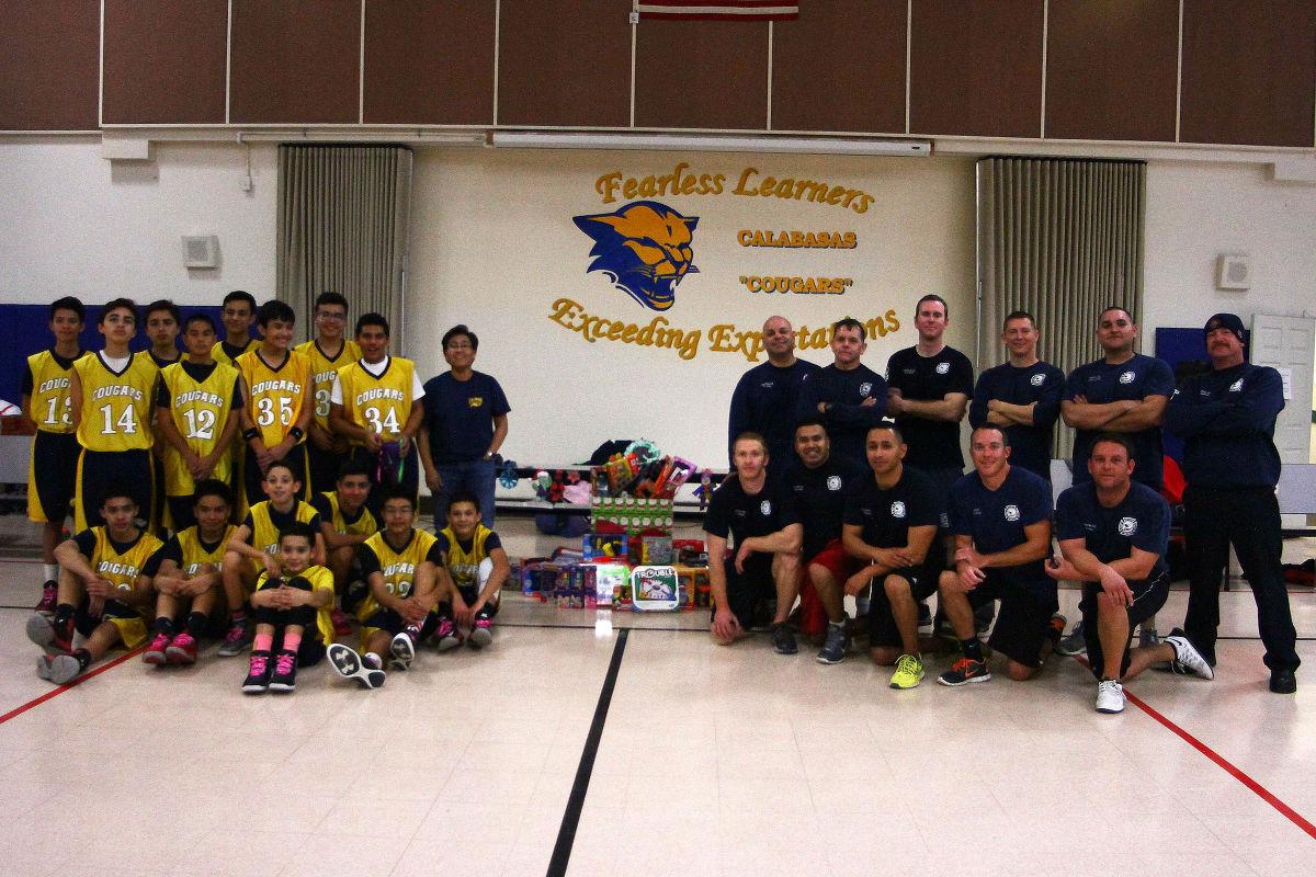 Charity game helps gather toys for children Community