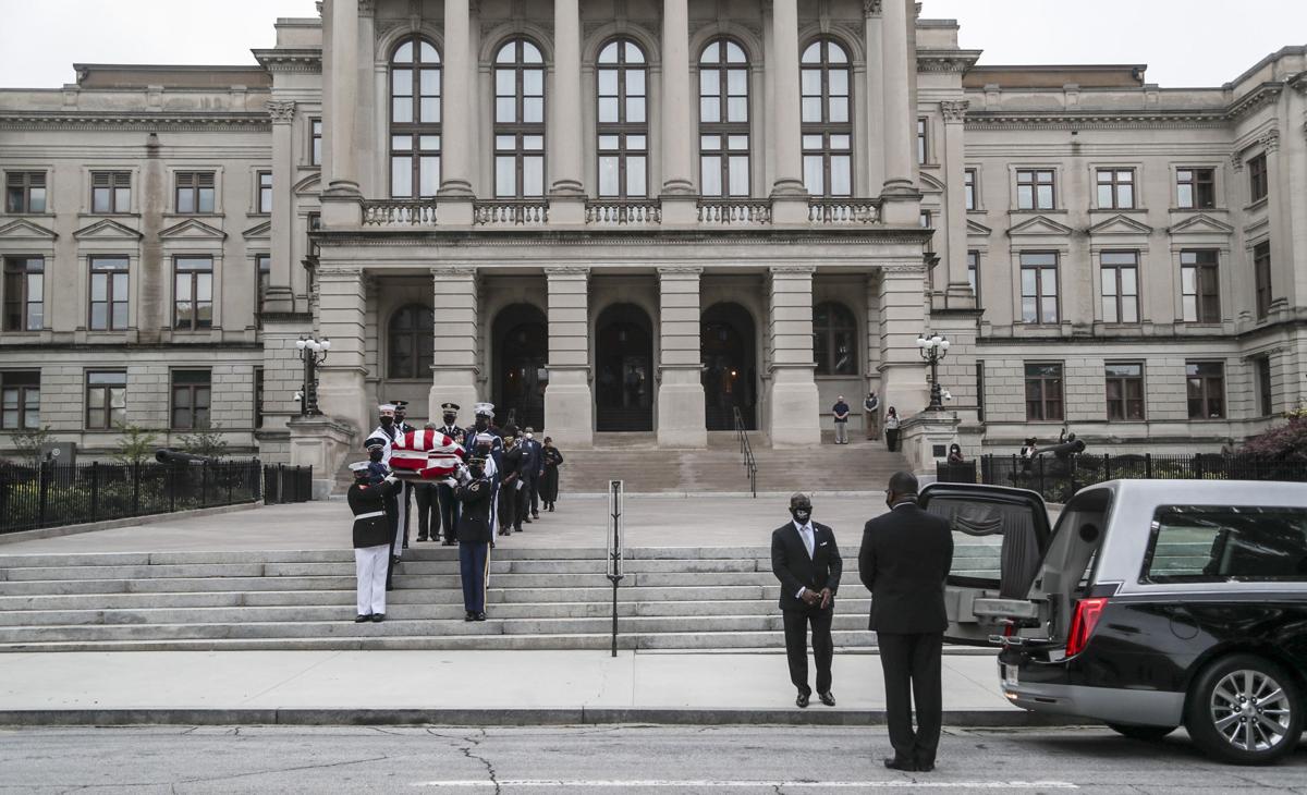 Members of Georgia's Black Caucus follow an honor guard carrying the casket of Rep. John Lewis from the Capitol on July 30, 2020 in Atlanta, Georgia. On the sixth day of the "Celebration of Life" for Rep. John Lewis, after traveling via motorcade from the Georgia state Capitol where he was lying in state overnight, his funeral is to be held at Ebeneezer Baptist Church in Atlanta, with burial to follow.