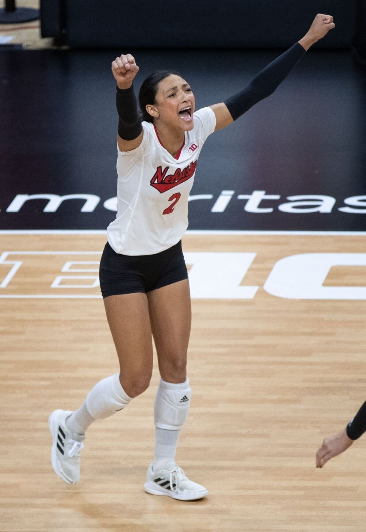 Why a police officer will travel to Nebraska with the Wisconsin volleyball  team