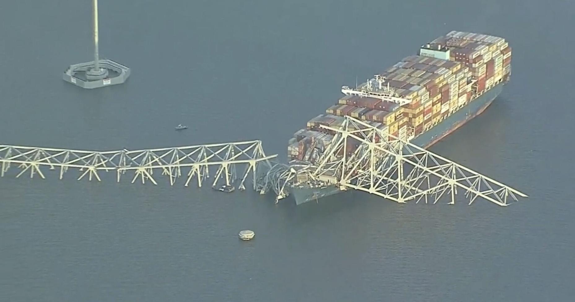 Cargo ship hits Baltimore's Key Bridge, bringing it down. Rescuers are looking for people in water. Video shows collapse, aftermath