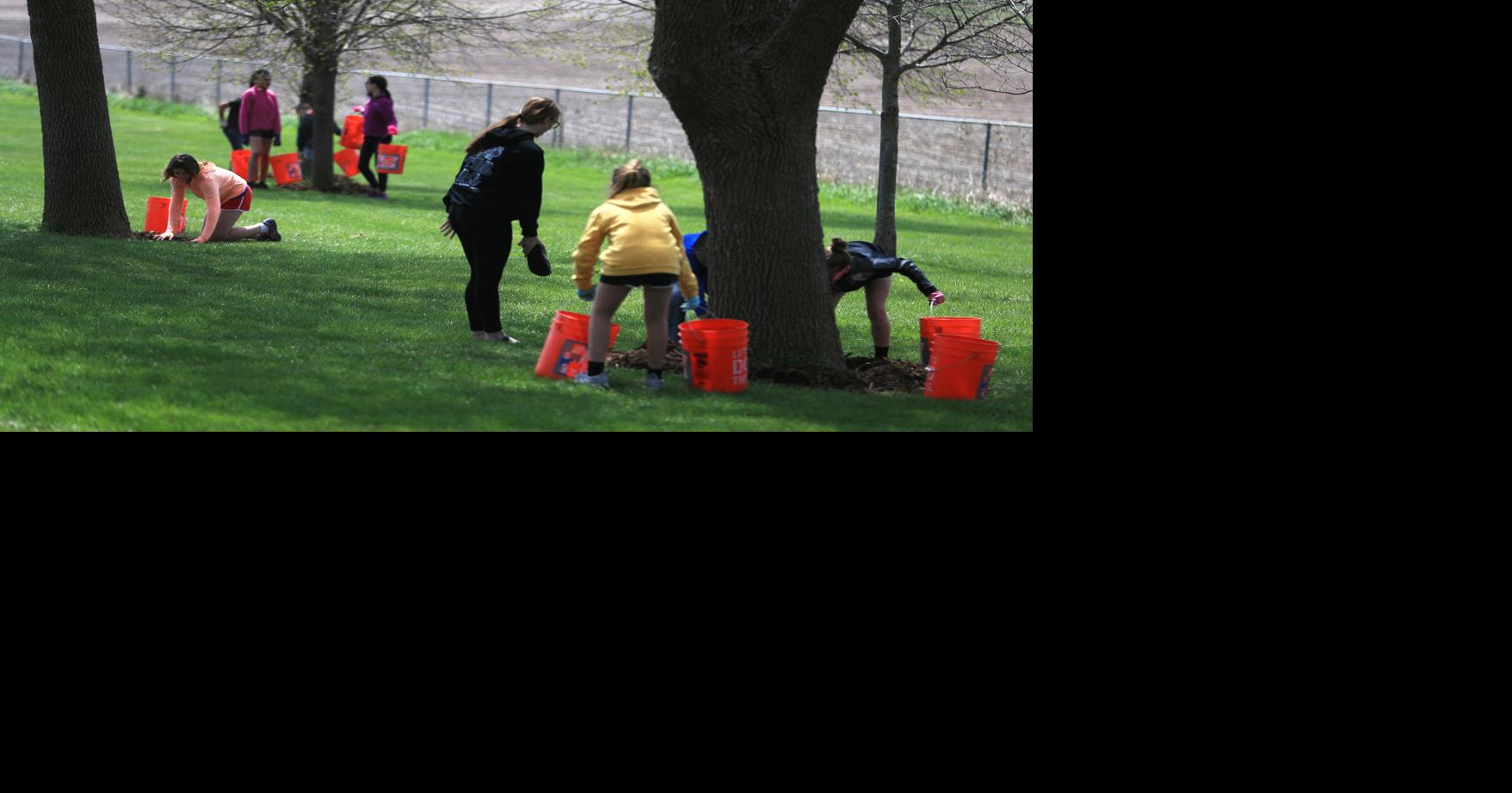 Photos Treynor Elementary students spread four tons of mulch on Thursday