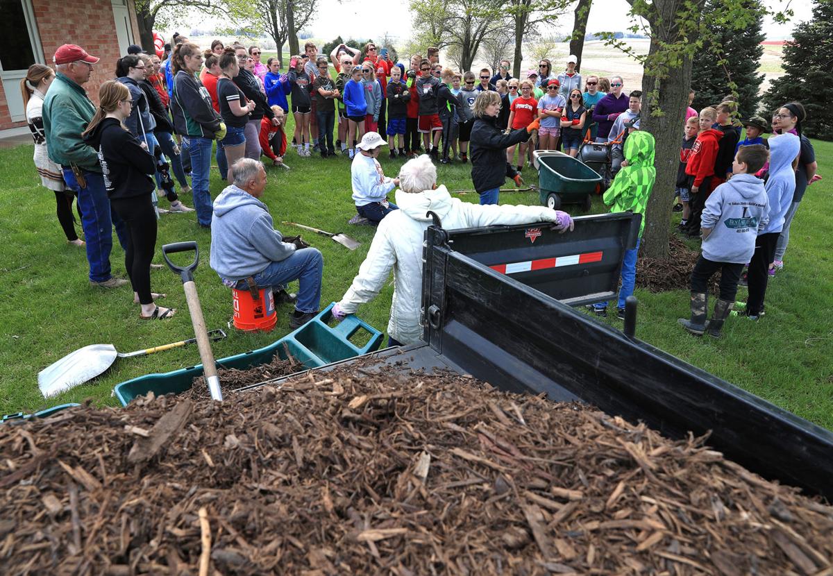 Photos Treynor Elementary students spread four tons of mulch on Thursday