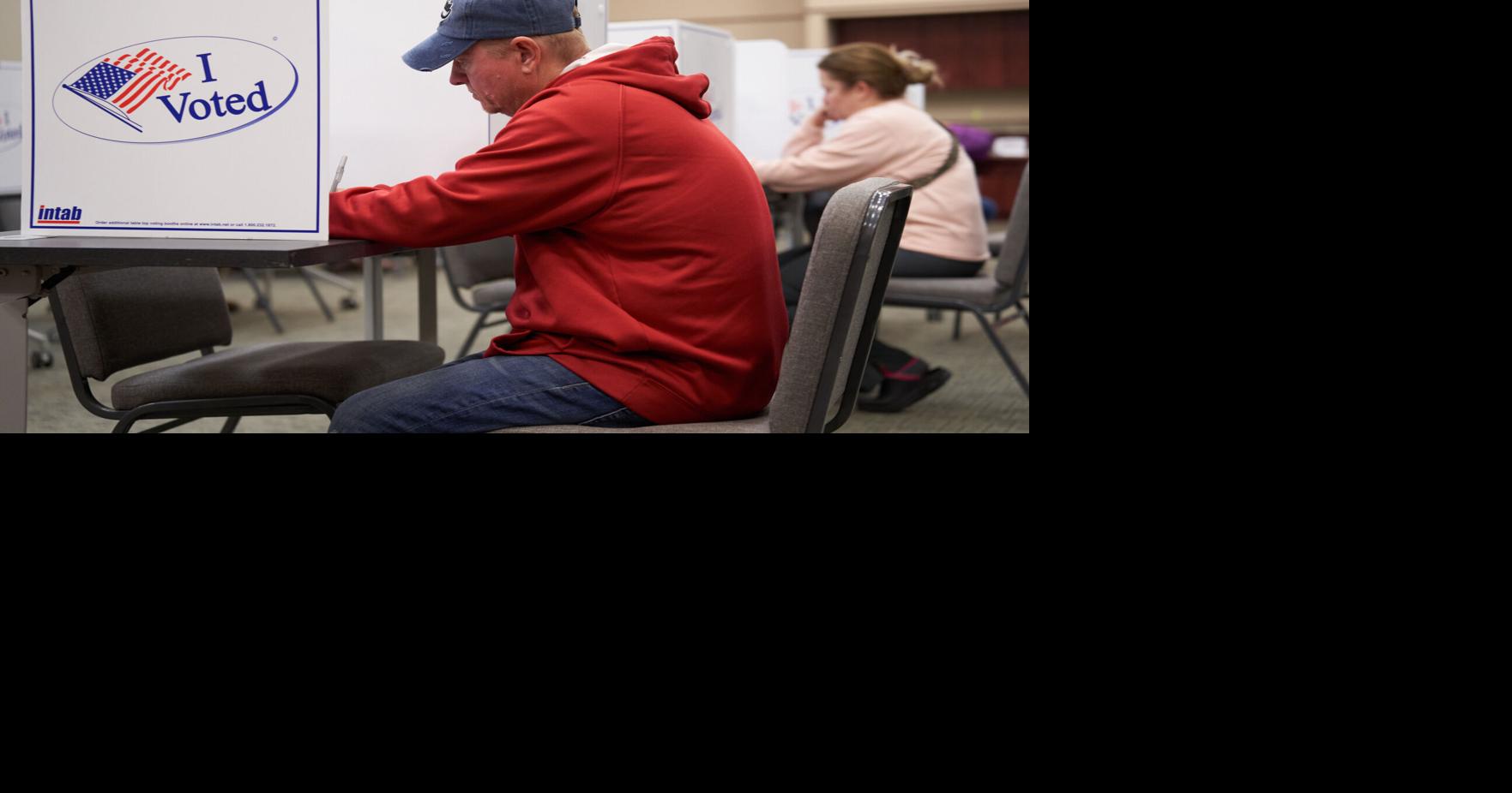 Voter comes straight from work to vote for bond