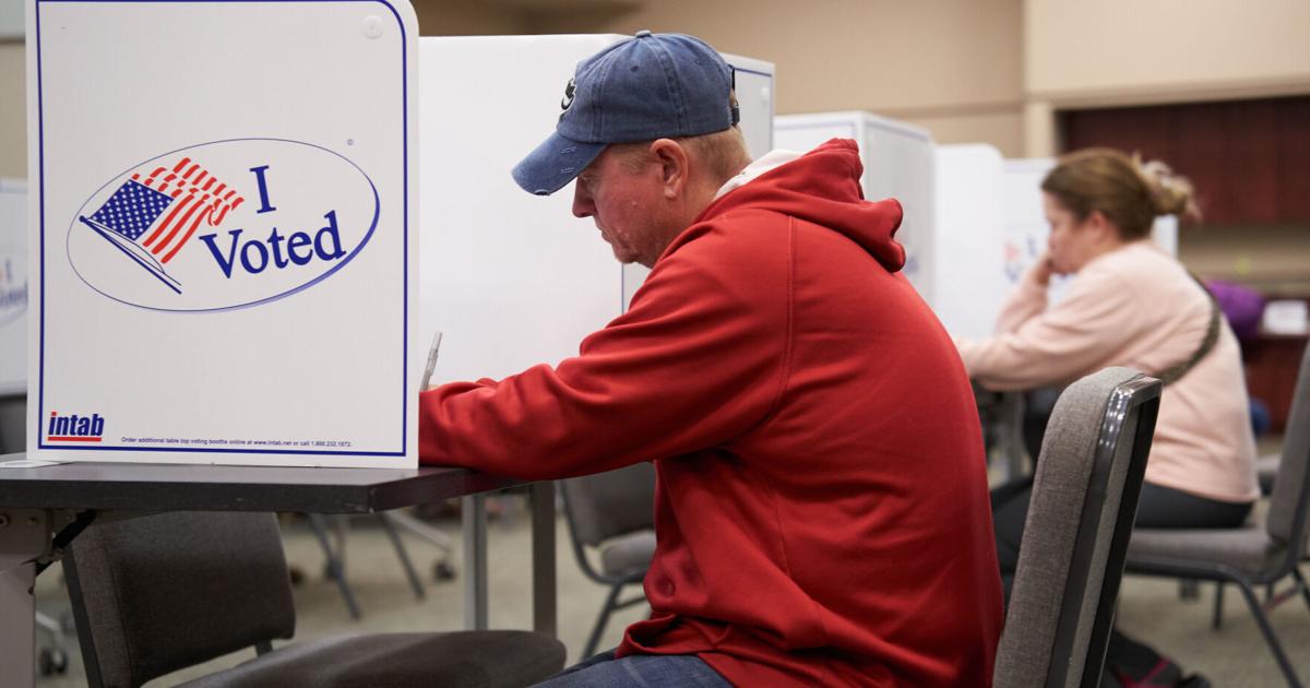 Voter comes straight from work to vote for bond