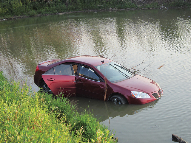 Woman drives car into Big Lake