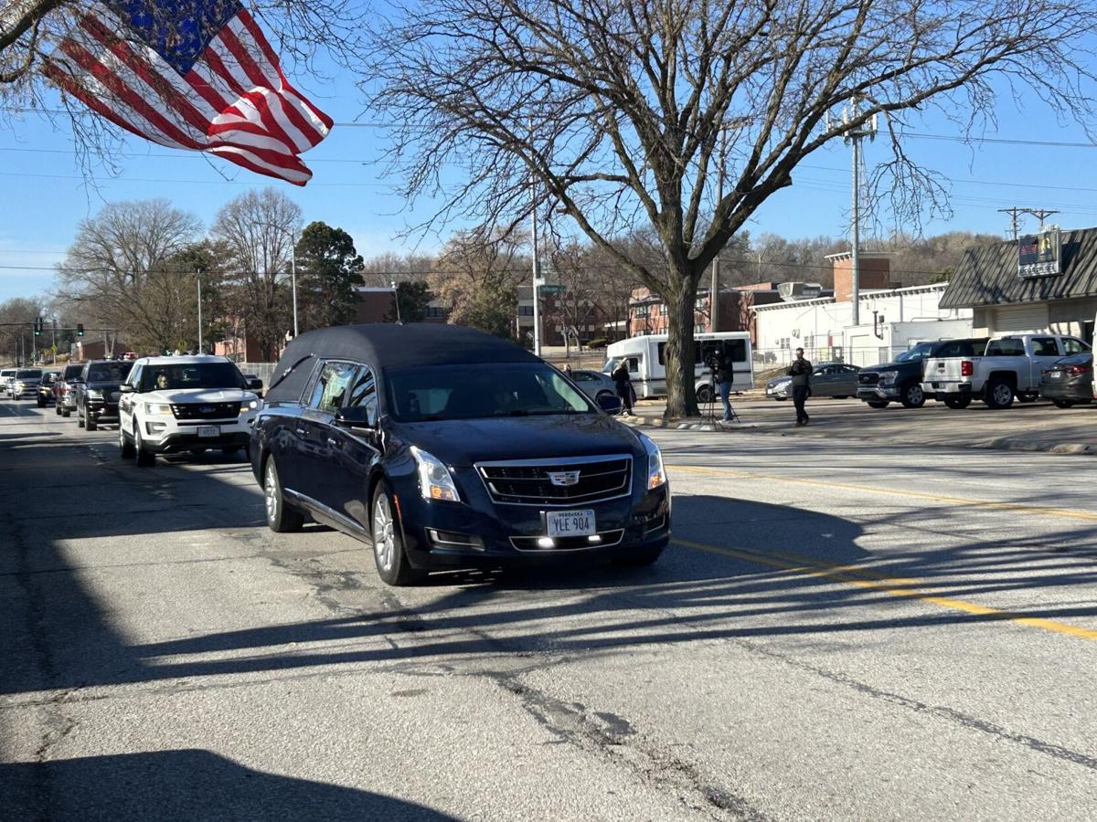 Funeral procession honors metro area police officer