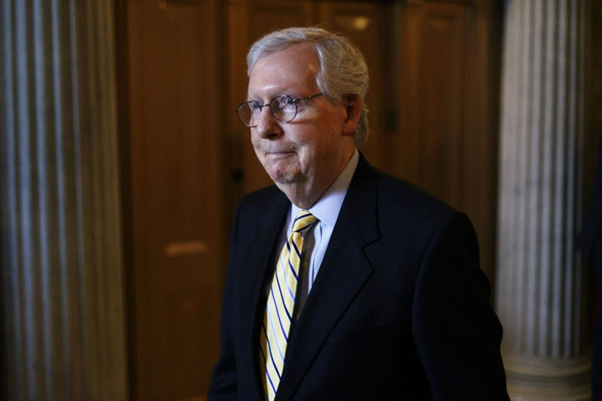 Mitch McConnell, R- Ky., walks in a hallway after a vote at the Senate chamber at the U.S. Capitol June 22, 2021, in Washington, D.C..