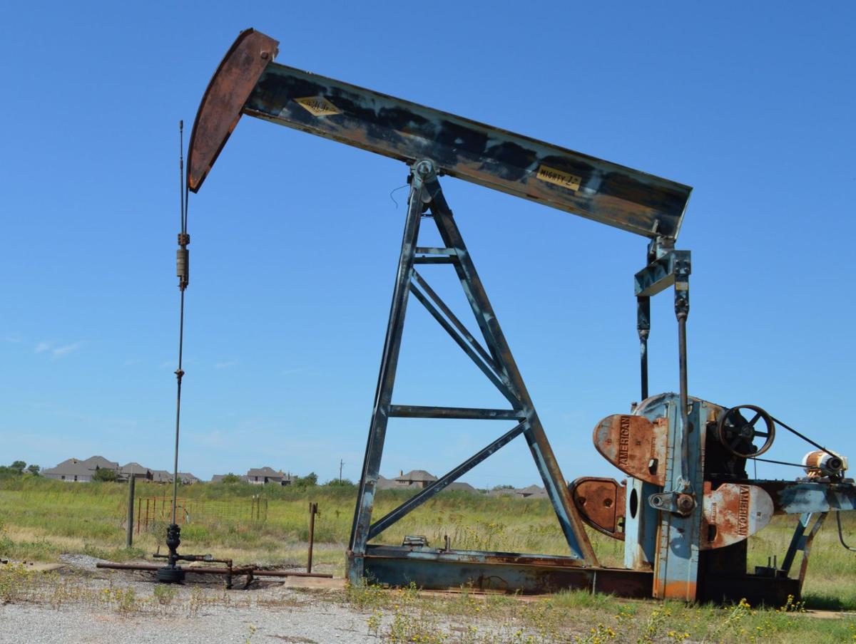 Homes are visible from well jack