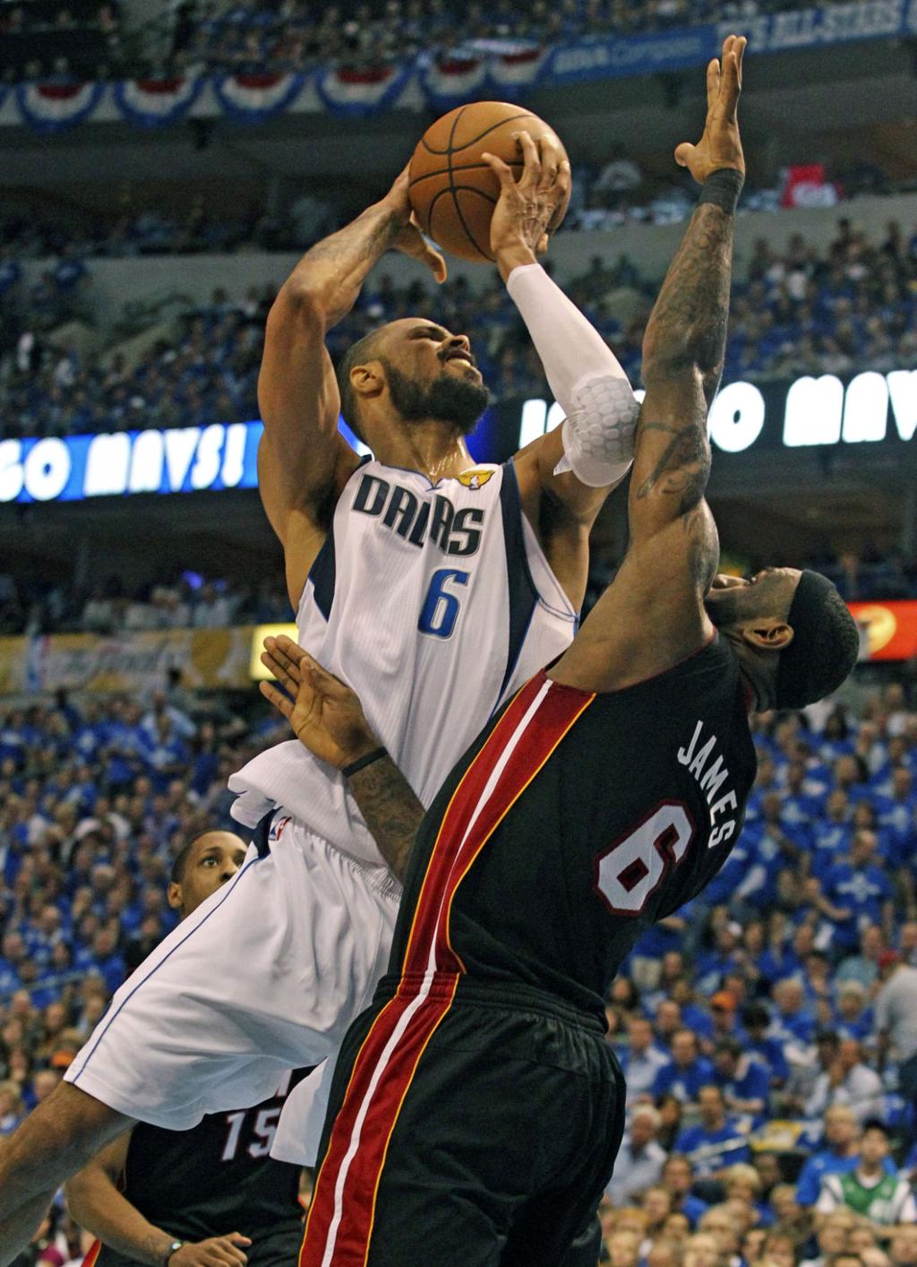 Mavs' Nowitzki has fever, but beats the Heat to even NBA FInals