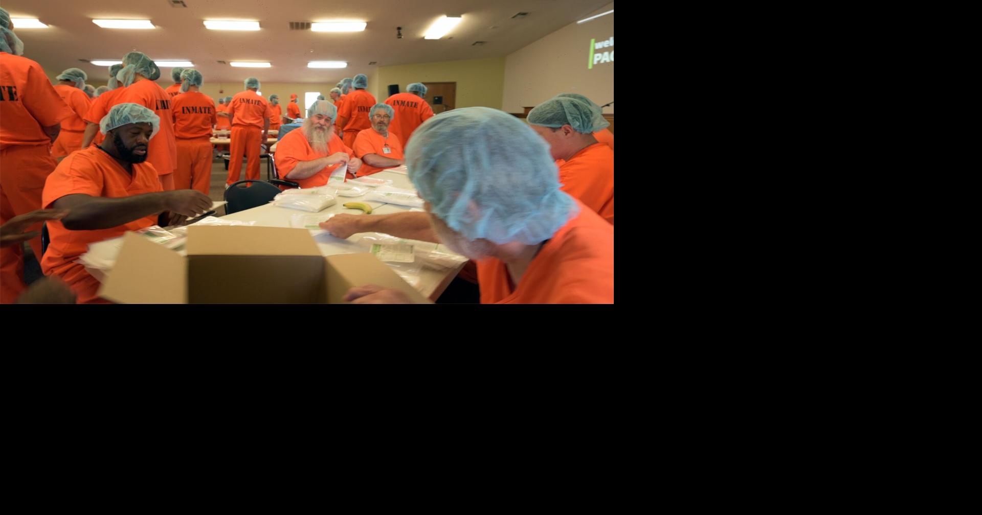 Inmates at Jess Dunn Correctional Center assemble thousands of meals