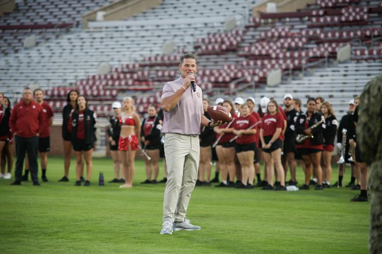 PHOTOS OU Naval ROTC runs a game ball to the Cotton Bowl ahead of Red